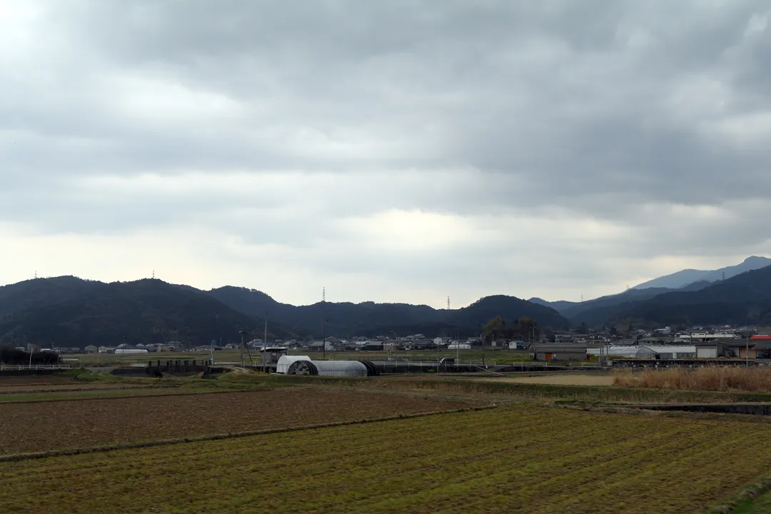 A farm seen from a Yodo Line train