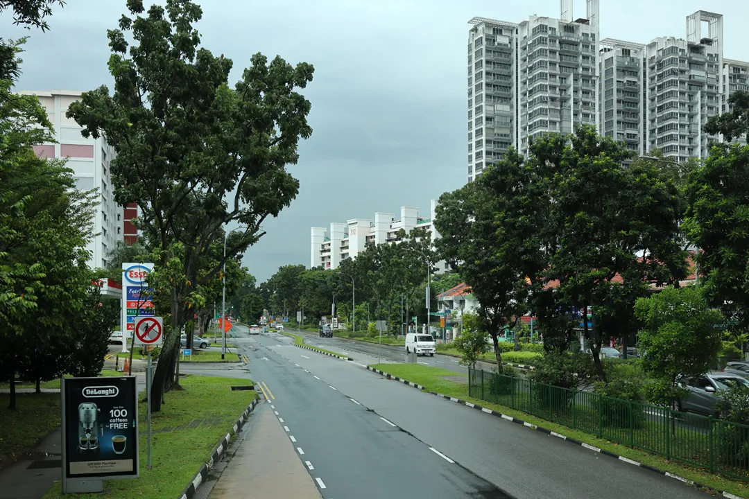 A typical road in a residential area seen from a bus