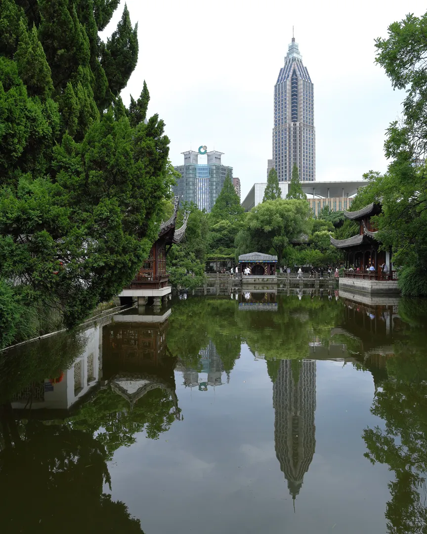 The same pond with the reflections of skyscrapers