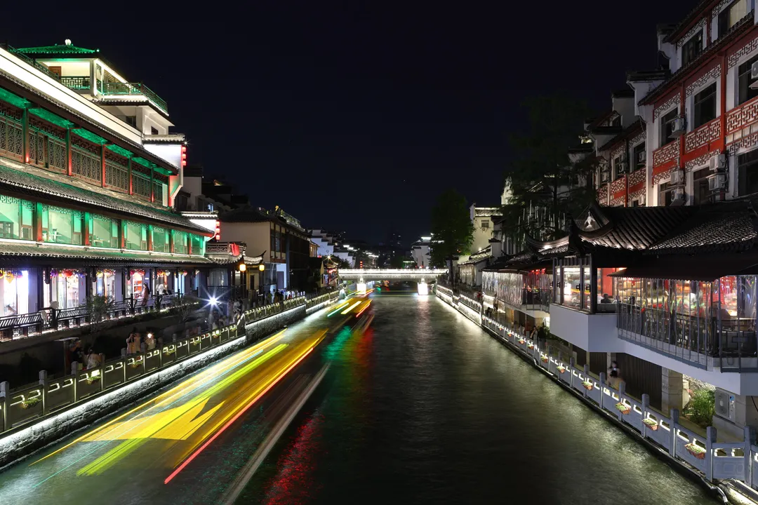 Light trails of boats in the river